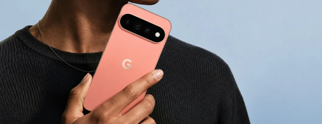 Person holding a coral Google Pixel 11 for repair service in Vancouver